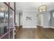 Inviting entryway features hardwood floors, neutral walls, and a decorative front door at 26 Hardpan Aly, Marietta, GA 30066