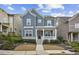 Charming two-story home featuring a cozy front porch and well-manicured landscaping at 26 Hardpan Aly, Marietta, GA 30066