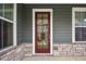 A close up view of the front door and surrounding stonework at 26 Hardpan Aly, Marietta, GA 30066