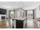Kitchen island overlooking the living space with stainless steel appliances at 26 Hardpan Aly, Marietta, GA 30066