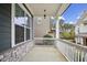 The covered porch features sturdy white railing and a stone base at 26 Hardpan Aly, Marietta, GA 30066