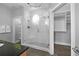Elegant bathroom with marble tiled shower, built-in seat, dark countertops and access to a custom closet at 1029 Piedmont Ne Ave # 102, Atlanta, GA 30309
