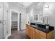 Modern bathroom featuring granite countertops, wood cabinetry, glass shower, and spacious custom closet at 1029 Piedmont Ne Ave # 102, Atlanta, GA 30309