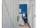 Bright bedroom featuring blue accent wall, sliding barn door, neutral decor, and a cozy, inviting atmosphere at 1029 Piedmont Ne Ave # 102, Atlanta, GA 30309