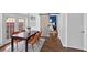 Dining room with sliding barn door to bedroom, hardwood flooring, and natural light at 1029 Piedmont Ne Ave # 102, Atlanta, GA 30309