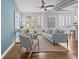 Bright living room with hardwood floors, modern furniture, and large windows at 1029 Piedmont Ne Ave # 102, Atlanta, GA 30309