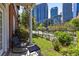 Private patio featuring a small table and seating with views of city skyline at 1029 Piedmont Ne Ave # 102, Atlanta, GA 30309