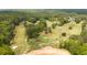 Aerial view of golf course featuring lush green fairways, sand traps, and mature trees at 1282 Eastridge Sw Rd, Atlanta, GA 30311