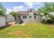 Backyard with a grass lawn and the back of the house at 1282 Eastridge Sw Rd, Atlanta, GA 30311
