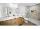 Beautifully renovated bathroom with double vanity, gold fixtures, and a spacious glass shower at 1282 Eastridge Sw Rd, Atlanta, GA 30311