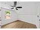 Bright bedroom with wood flooring, a ceiling fan and a window at 1282 Eastridge Sw Rd, Atlanta, GA 30311