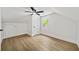 This bedroom has wood flooring, white walls and a ceiling fan at 1282 Eastridge Sw Rd, Atlanta, GA 30311