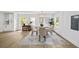 Charming dining area with natural light, a modern chandelier, and neutral decor at 1282 Eastridge Sw Rd, Atlanta, GA 30311