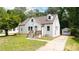 Charming home with fresh white siding, well-kept lawn and private detached garage at 1282 Eastridge Sw Rd, Atlanta, GA 30311