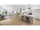 Open-concept space with modern kitchen island and adjacent dining area with seating at 1282 Eastridge Sw Rd, Atlanta, GA 30311