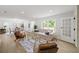 Bright living room with updated flooring, neutral decor, and ample natural light at 1282 Eastridge Sw Rd, Atlanta, GA 30311