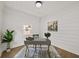 Cozy home office featuring shiplap accent wall, modern desk, and natural light at 1282 Eastridge Sw Rd, Atlanta, GA 30311
