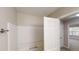 Hall bathroom with a shower and a view to the bedroom and window at 2740 Ashley Downs Ln, Atlanta, GA 30349