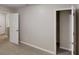 Bedroom features neutral walls, carpet, and multiple doors at 2740 Ashley Downs Ln, Atlanta, GA 30349