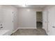 Dining room area with gray tile flooring, and interior doors at 2740 Ashley Downs Ln, Atlanta, GA 30349