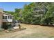 Relaxing backyard scene, complemented by mature trees at 3925 Waterford Dr, Suwanee, GA 30024