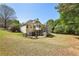Large backyard with a deck, landscaping, and ample space for recreation at 3925 Waterford Dr, Suwanee, GA 30024