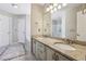 Bathroom featuring a double vanity with granite countertops, tiled floors, and a separate shower at 3925 Waterford Dr, Suwanee, GA 30024