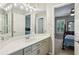 Bathroom featuring a modern vanity with double sinks and a well-lit mirror at 3925 Waterford Dr, Suwanee, GA 30024