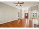Spacious living area showcasing hardwood floors and an open layout with natural light at 3925 Waterford Dr, Suwanee, GA 30024