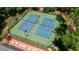 Aerial view of community tennis courts with surrounding greenery and seating areas at 3925 Waterford Dr, Suwanee, GA 30024