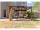 Backyard patio area featuring an outdoor living space, lush lawn and landscaping at 4013 Suwanee Place Dr, Suwanee, GA 30024