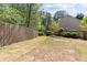 An expansive backyard with lush green lawn and a wood privacy fence at 4013 Suwanee Place Dr, Suwanee, GA 30024