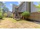 Backyard featuring an outdoor living space, lush lawn and landscaping at 4013 Suwanee Place Dr, Suwanee, GA 30024