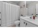 A full bathroom with a shower/tub, white vanity and neutral walls at 4013 Suwanee Place Dr, Suwanee, GA 30024