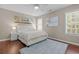 Bright bedroom featuring hardwood floors and natural light at 4013 Suwanee Place Dr, Suwanee, GA 30024