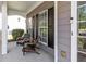 Inviting front porch with cozy seating, offering a relaxing outdoor space with great curb appeal at 4013 Suwanee Place Dr, Suwanee, GA 30024