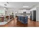 Spacious kitchen with stainless steel appliances, a large island, and an open view to the dining area at 4013 Suwanee Place Dr, Suwanee, GA 30024