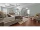 Spacious main bedroom with tray ceilings, hardwood floors, and plenty of natural light at 4013 Suwanee Place Dr, Suwanee, GA 30024