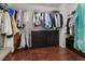 Walk-in closet with ample hanging space and built-in storage drawers at 4013 Suwanee Place Dr, Suwanee, GA 30024
