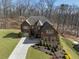 Overhead view of a red brick home with manicured landscaping and a long driveway at 4538 Sterling Pointe Nw Dr, Kennesaw, GA 30152