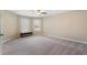 Spacious bedroom with neutral walls, carpet flooring, a ceiling fan, and plenty of natural light at 4538 Sterling Pointe Nw Dr, Kennesaw, GA 30152