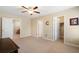 Neutral bedroom with carpet, ceiling fan, closet access, and doorways to other rooms in the house at 4538 Sterling Pointe Nw Dr, Kennesaw, GA 30152