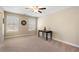 Bedroom with neutral walls, carpet flooring, a ceiling fan, and two windows with natural light at 4538 Sterling Pointe Nw Dr, Kennesaw, GA 30152