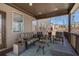 Inviting covered porch with stylish seating and view of natural surroundings at 4538 Sterling Pointe Nw Dr, Kennesaw, GA 30152