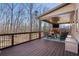 Covered porch features a TV, brick fireplace, and comfortable seating at 4538 Sterling Pointe Nw Dr, Kennesaw, GA 30152