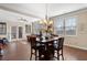 Bright dining area with hardwood floors, large windows, and a stylish chandelier at 4538 Sterling Pointe Nw Dr, Kennesaw, GA 30152