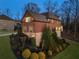 Charming brick home with well-maintained landscaping and stone accents, creating an inviting and picturesque setting at 4538 Sterling Pointe Nw Dr, Kennesaw, GA 30152