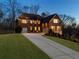 Charming two-story brick home with a well-maintained lawn, elegant landscaping, and attached garage at 4538 Sterling Pointe Nw Dr, Kennesaw, GA 30152