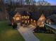 Stunning brick home with a two-car garage, lush landscaping, and a spacious driveway, providing ample parking at 4538 Sterling Pointe Nw Dr, Kennesaw, GA 30152