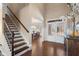 Elegant foyer showcasing hardwood floors, a grand staircase, and natural light, creating a welcoming entrance at 4538 Sterling Pointe Nw Dr, Kennesaw, GA 30152